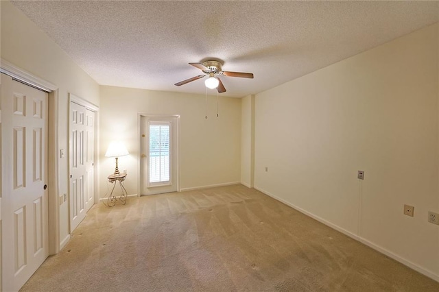 1800 Clairmont Lk Unit 213, Decatur, GA 30033 - unfurnished room with light colored carpet, a ceiling fan, and a textured ceiling