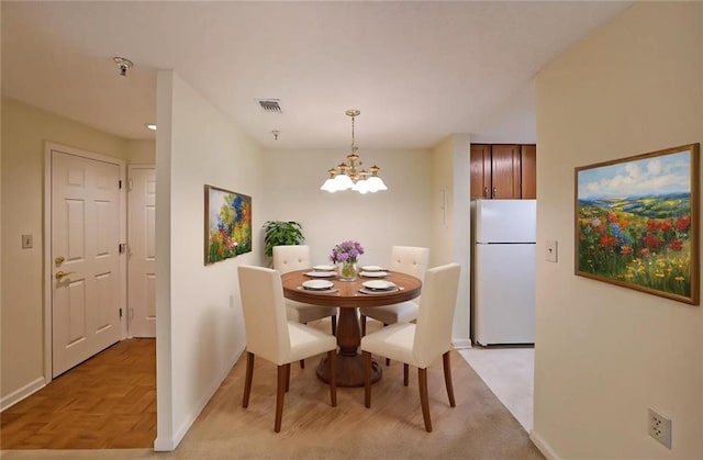1800 Clairmont Lk Unit 213, Decatur, GA 30033 - dining space featuring baseboards and a chandelier