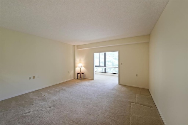 1800 Clairmont Lk Unit 213, Decatur, GA 30033 - empty room featuring carpet flooring, a textured ceiling, and baseboards