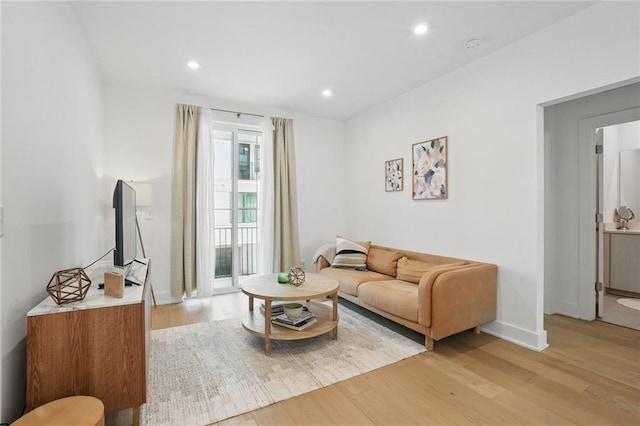 230 New St Unit 2102, Decatur, GA 30030 - living room featuring light wood-type flooring, recessed lighting, and baseboards