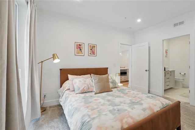 230 New St Unit 2102, Decatur, GA 30030 - bedroom with light carpet, recessed lighting, baseboards, ensuite bathroom, and visible vents