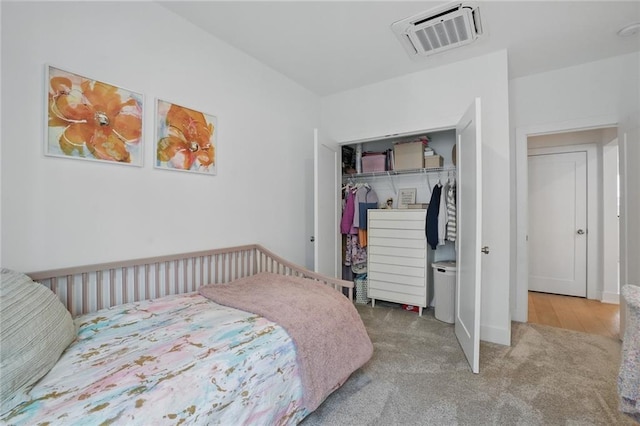 230 New St Unit 2102, Decatur, GA 30030 - bedroom featuring carpet floors, a closet, and visible vents
