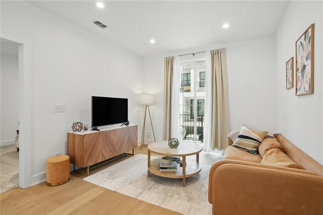 230 New St Unit 2102, Decatur, GA 30030 - living room with recessed lighting, baseboards, visible vents, and light wood-type flooring