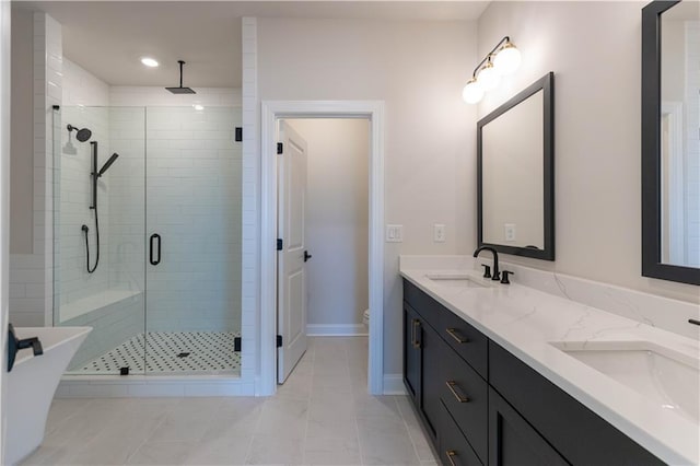 bathroom with vanity, toilet, and an enclosed shower