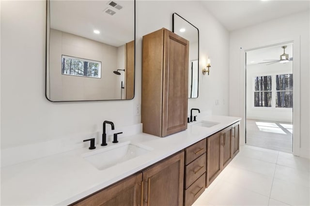 bathroom featuring ceiling fan, tile patterned flooring, and vanity