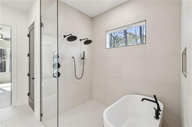 bathroom featuring separate shower and tub