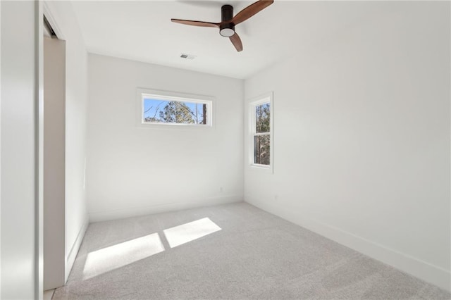 unfurnished room with light carpet and ceiling fan