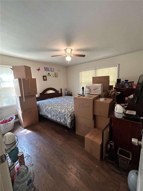 bedroom featuring dark hardwood / wood-style flooring and ceiling fan