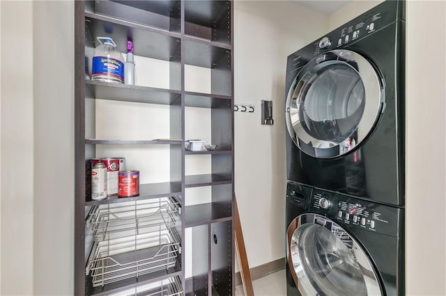 washroom with stacked washer / drying machine