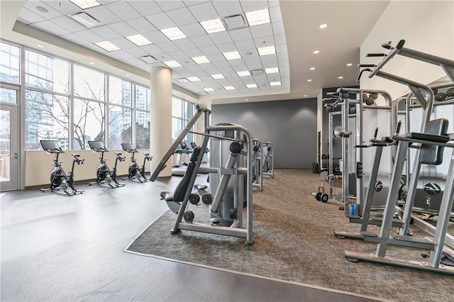 exercise room featuring a drop ceiling