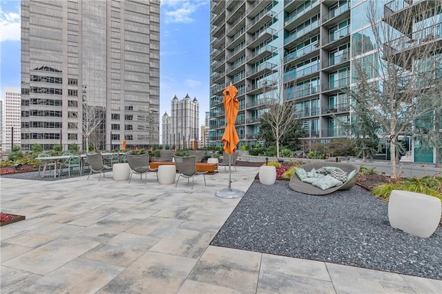 view of property's community featuring a patio area