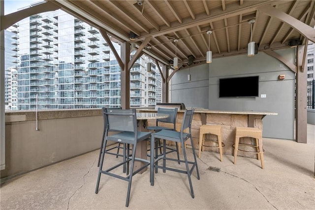 view of patio with an outdoor bar