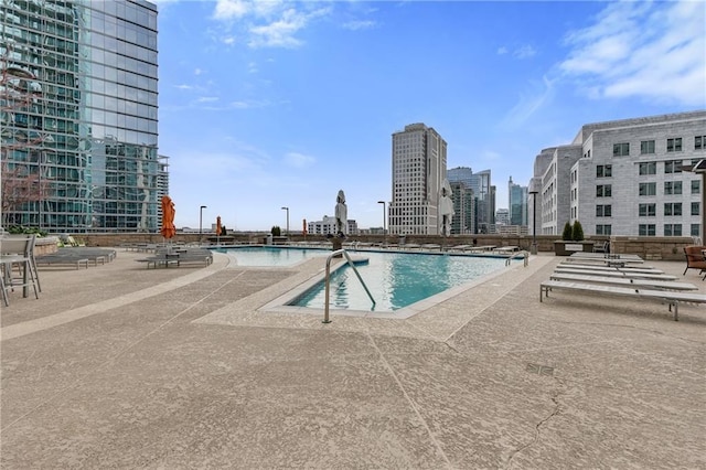 view of swimming pool featuring a patio area