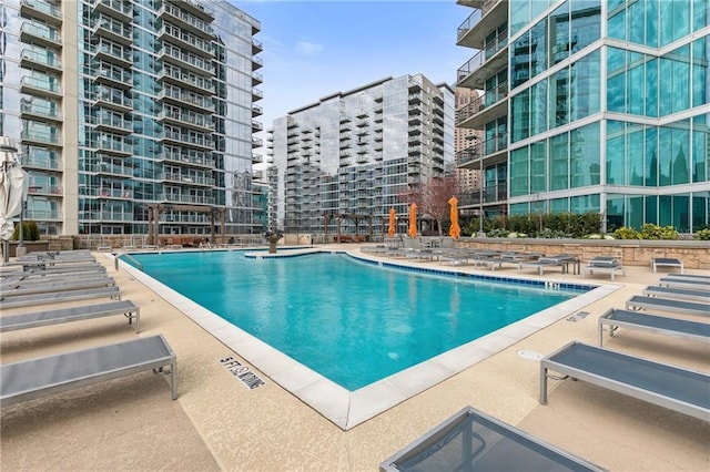 view of swimming pool with a patio area