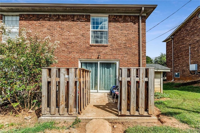 rear view of house with a yard