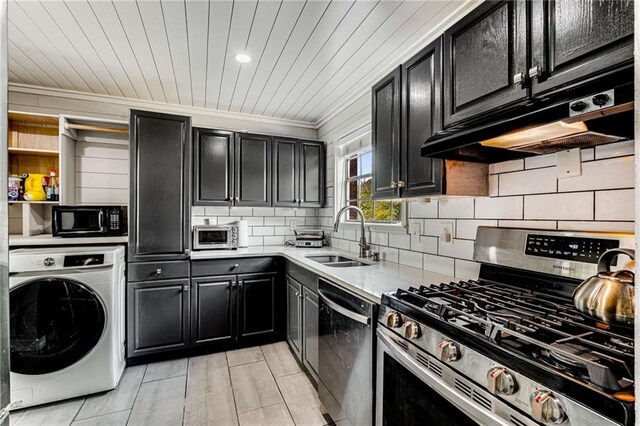 kitchen with decorative backsplash, stainless steel appliances, crown molding, washer / dryer, and sink