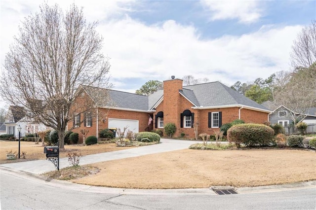 view of front of home with brick siding, driveway, a chimney, and an attached garage