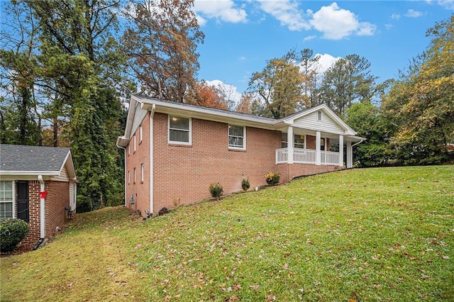 view of property exterior featuring a yard and covered porch