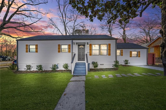 view of front of house with a yard