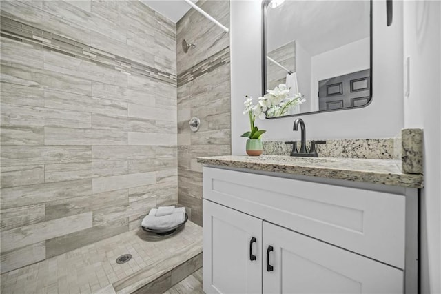 bathroom with curtained shower and vanity