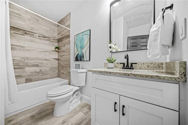 full bathroom with hardwood / wood-style floors, toilet, vanity, and shower / tub combo with curtain