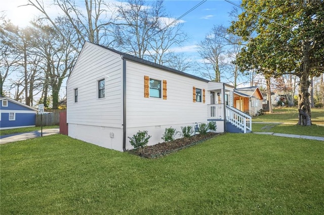 view of property exterior featuring a yard