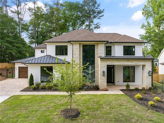 modern farmhouse style home with covered porch and a front yard