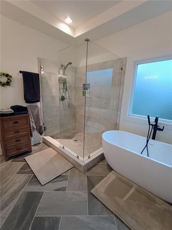 336 White Oak Way, Monroe, GA 30655 - bathroom featuring tiled shower, a freestanding tub, and recessed lighting