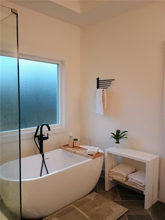 336 White Oak Way, Monroe, GA 30655 - bathroom with a soaking tub and tile patterned flooring