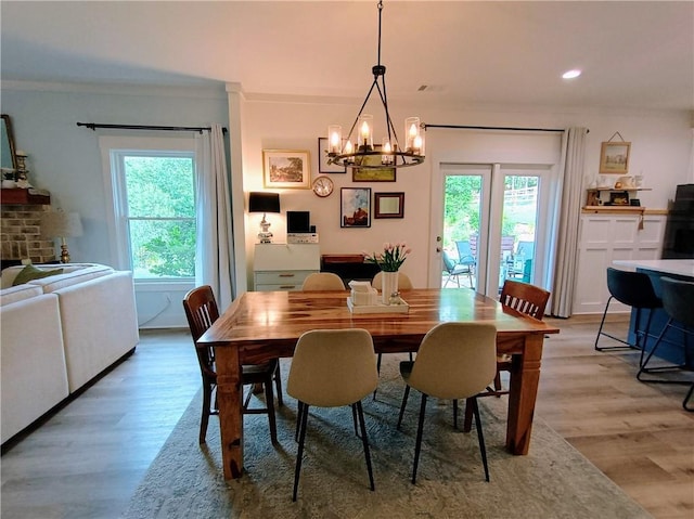 336 White Oak Way, Monroe, GA 30655 - dining space with plenty of natural light, light wood finished floors, a chandelier, recessed lighting, and crown molding