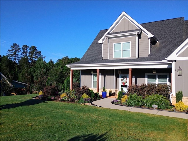 336 White Oak Way, Monroe, GA 30655 - view of front of house with board and batten siding, a front lawn, and roof with shingles