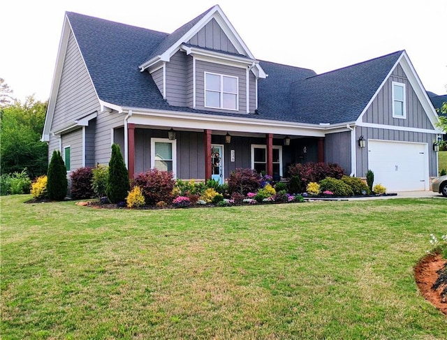 336 White Oak Way, Monroe, GA 30655 - view of front of house featuring an attached garage, a front yard, roof with shingles, and board and batten siding