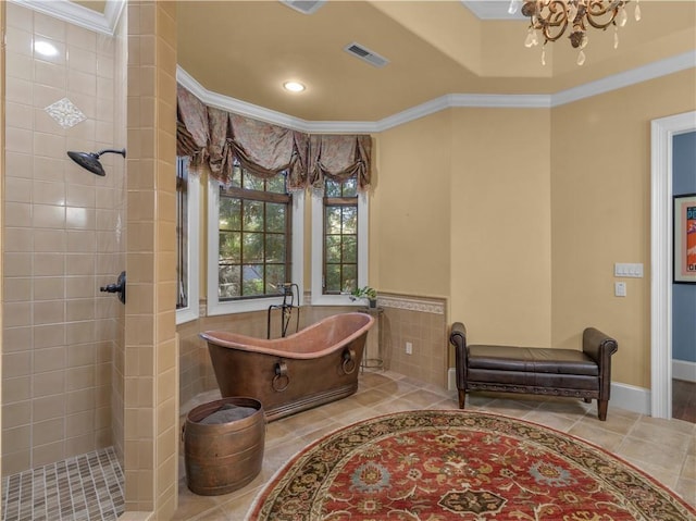 full bath with a soaking tub, ornamental molding, and a tile shower