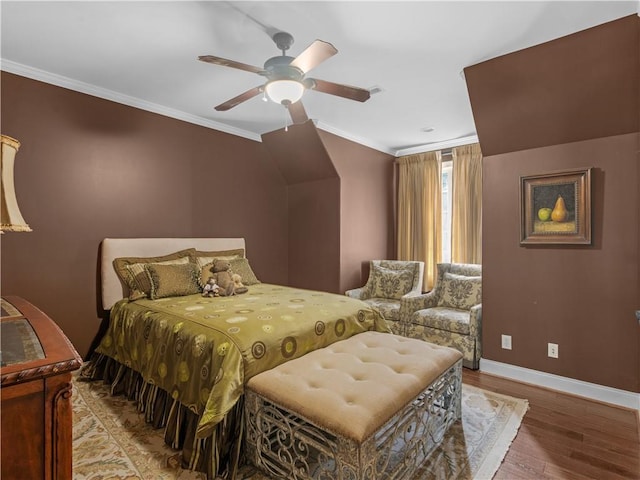 bedroom with wood finished floors, baseboards, ornamental molding, and ceiling fan