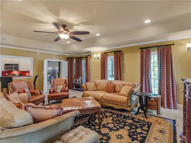 living area featuring recessed lighting, a healthy amount of sunlight, crown molding, and ceiling fan