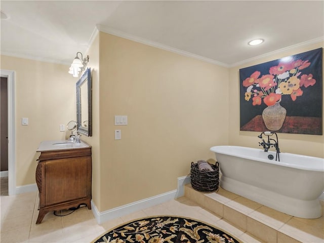 bathroom featuring tile patterned floors, baseboards, a freestanding bath, and crown molding