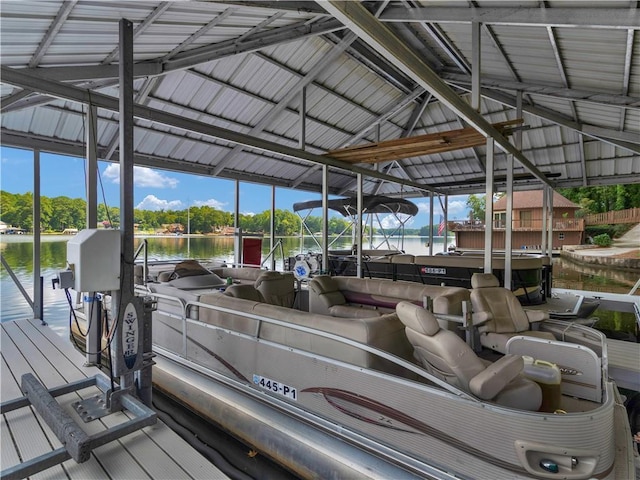 dock area featuring boat lift and a water view