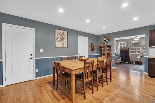 dining space featuring a wainscoted wall, recessed lighting, a ceiling fan, and light wood-style floors