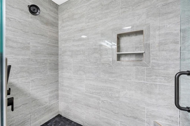 full bathroom featuring a shower stall