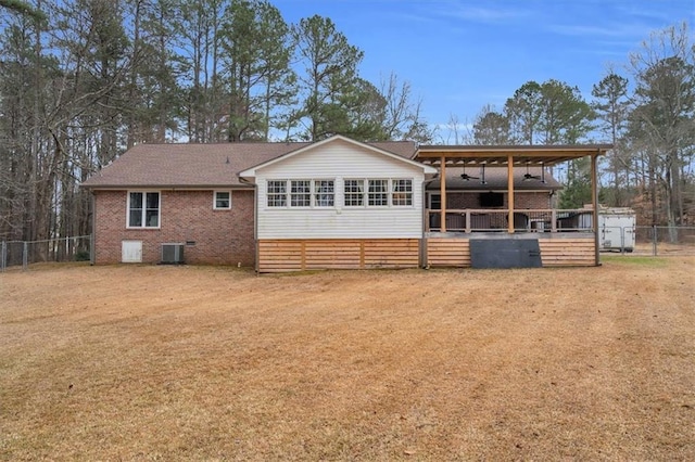 back of house with ceiling fan, central AC, brick siding, fence, and crawl space