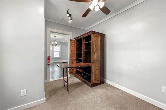 home office with crown molding, light colored carpet, and ceiling fan with notable chandelier