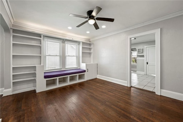 interior space featuring hardwood / wood-style flooring, ceiling fan, ornamental molding, and a wealth of natural light