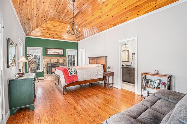 bedroom with ornamental molding, wooden ceiling, an inviting chandelier, and wood finished floors