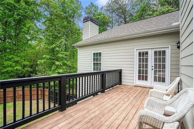 255 Heritage Creek Trl, Ball Ground, GA 30107 - wooden deck with french doors and fence