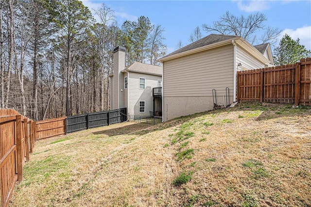 view of yard with a fenced backyard