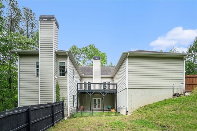255 Heritage Creek Trl, Ball Ground, GA 30107 - rear view of property with a chimney, french doors, and a wooden deck