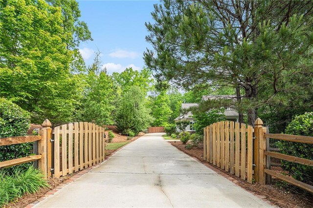 255 Heritage Creek Trl, Ball Ground, GA 30107 - view of property's community with a gate and fence