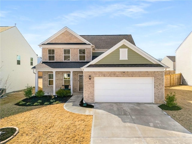 view of front of property featuring concrete driveway, brick siding, an attached garage, and fence