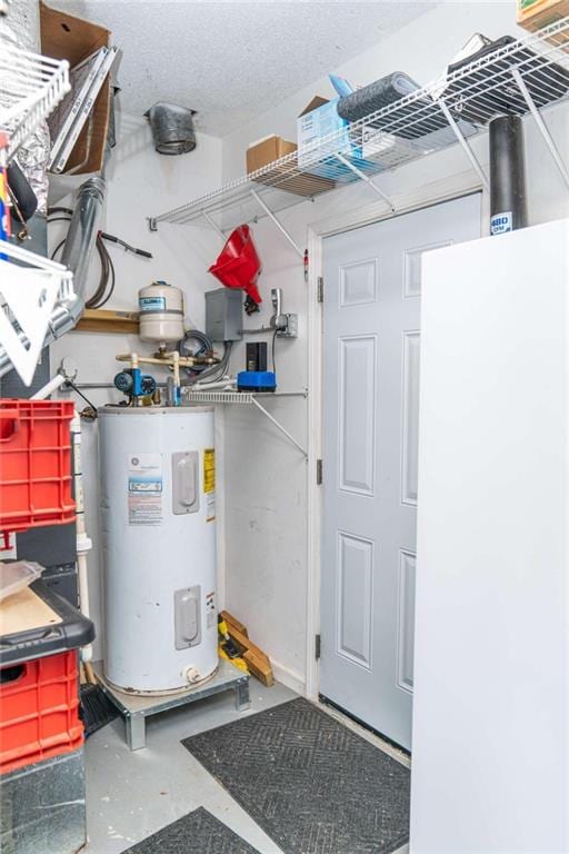 utility room featuring electric water heater