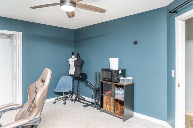 office with ceiling fan and carpet